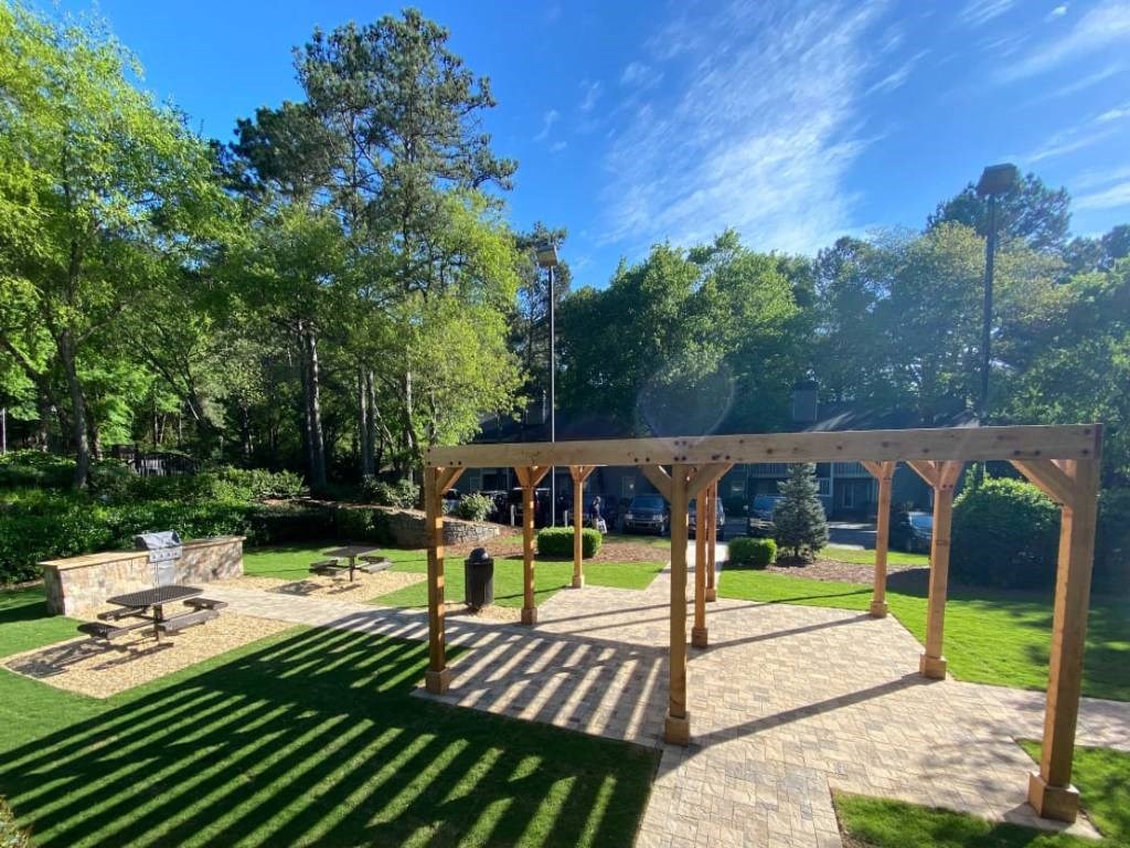 a picnic area in a park with trees