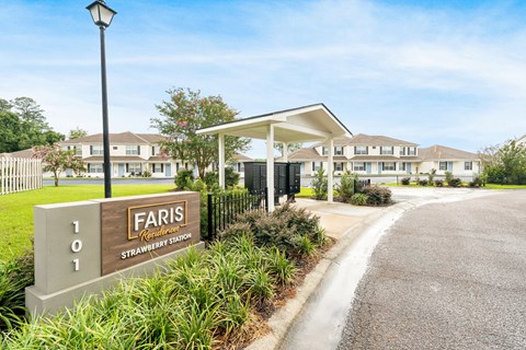 The image shows a sign for Faris located at the entrance of a residential area.