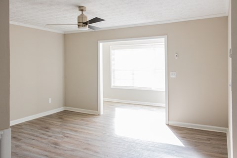 Living space with sunroom and ceiling fan at Twin Springs, Norcross, GA