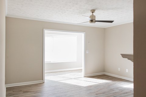 Spacious living room with ceiling fan at Twin Springs, Norcross, GA