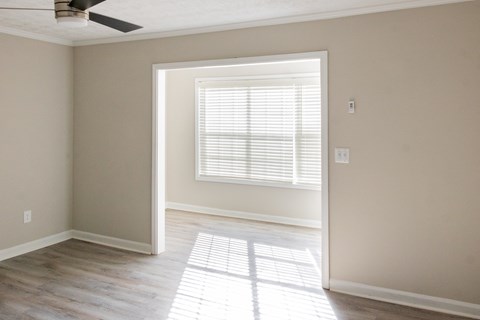 Living space with large windows for natural light at Twin Springs Apartments, Norcross, GA