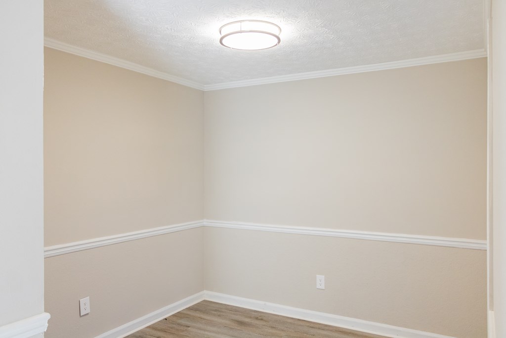 Dinning room with wood like flooring at Twin Springs Apartments, Norcrss, GA