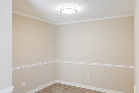 Dinning room with wood like flooring at Twin Springs Apartments, Norcrss, GA