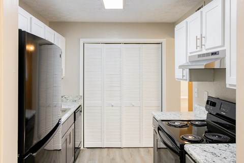 Kitchen with pantry at Twin Springs Apartments, Norcross, GA