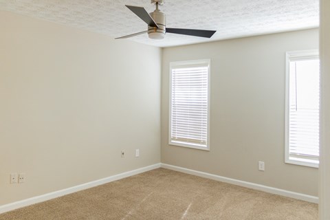 Ceiling fan and plush carpet at Twin Springs Apartments, Norcross, GA