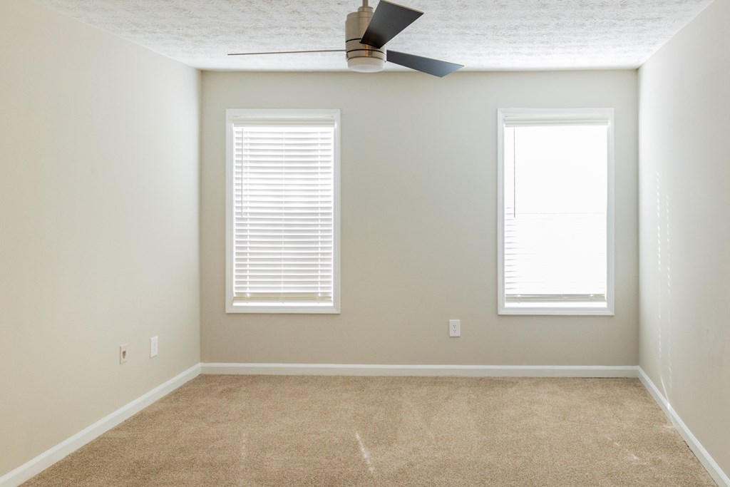 Bedroom with ceiling fan at Twin Springs Apartments, Norcross, GA