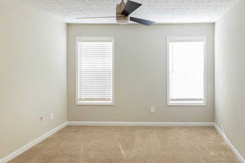 Bedroom with ceiling fan at Twin Springs Apartments, Norcross, GA
