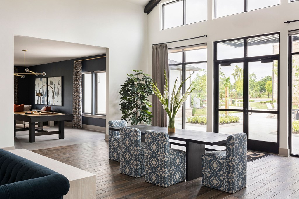 a living room with a large table and chairs and a pool table at The Cannon, Murfreesboro, TN 37130