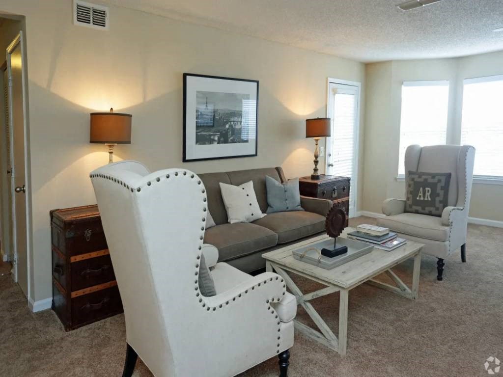 a living room with a couch and a table