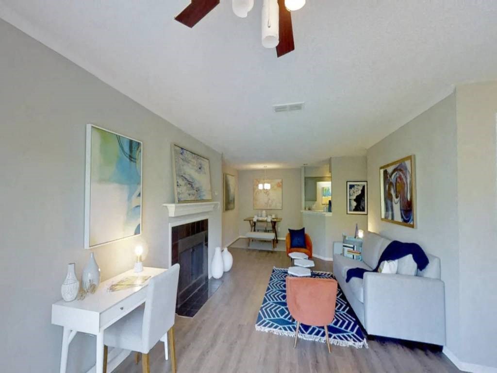 a living room with a couch and a fireplace