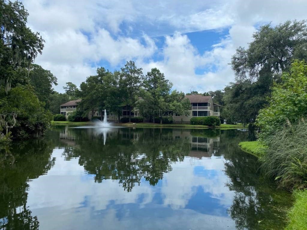 the building in which the resort is located is reflected in the lake
