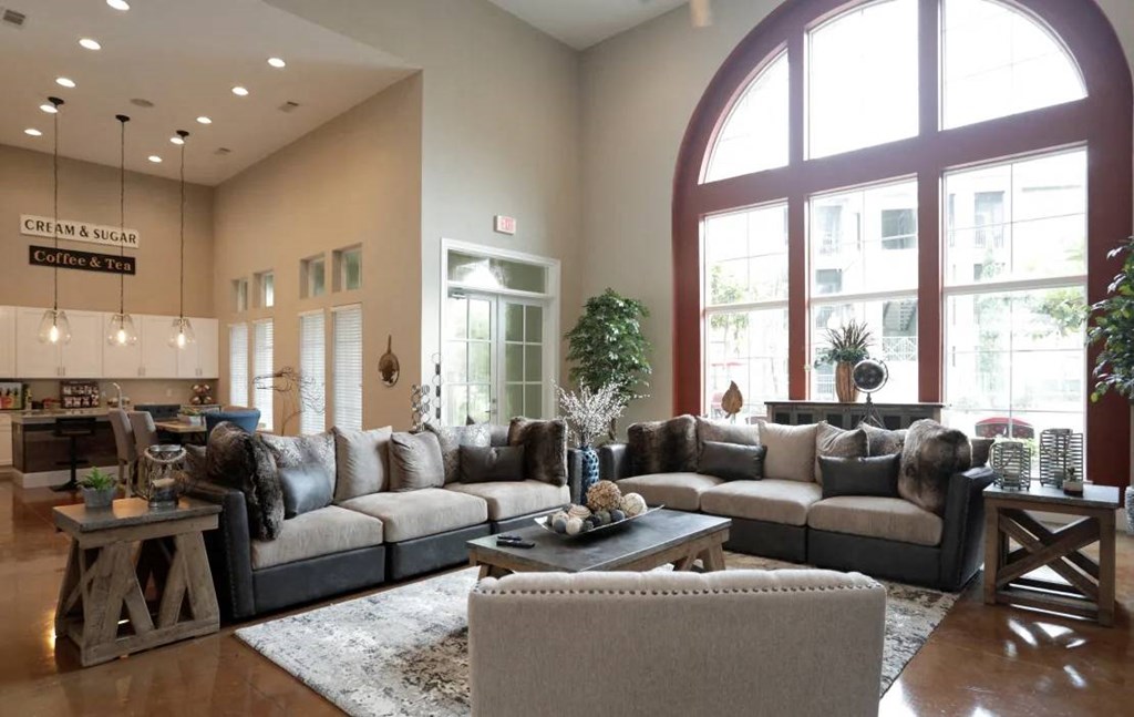 a living room filled with furniture and a large window at Kings Cove, Kingwood, TX