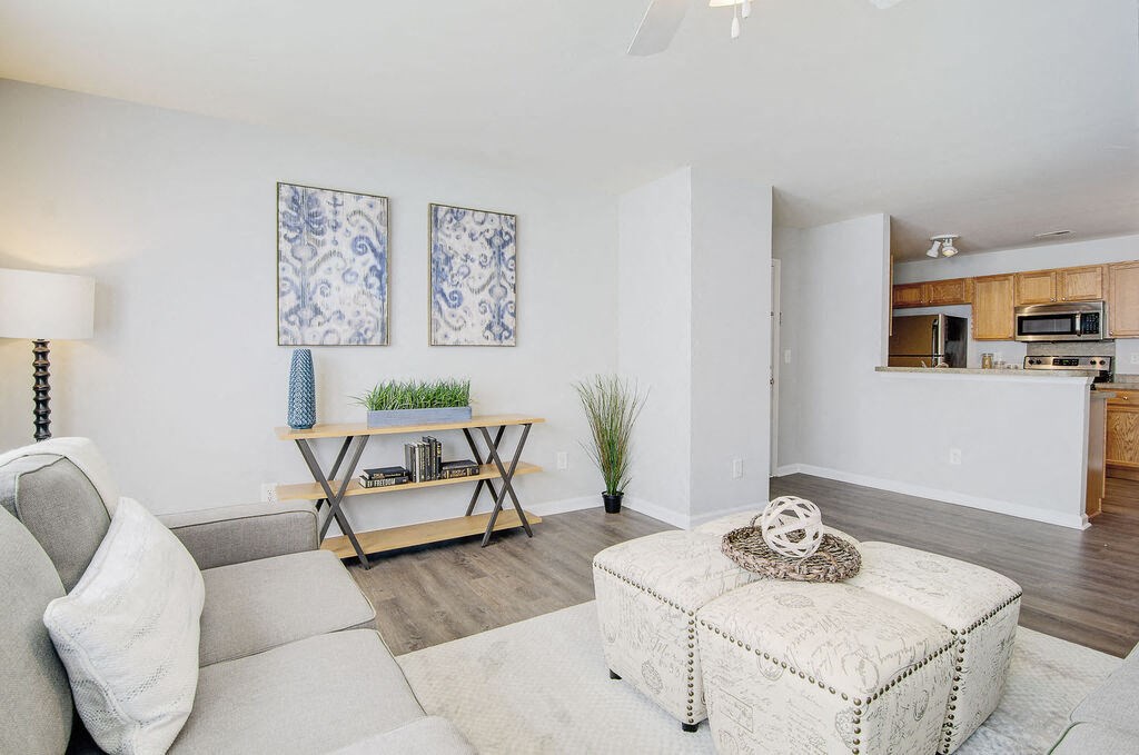 a living room with a couch and a coffee table at Enclave at West Ashley Apartments, Charleston