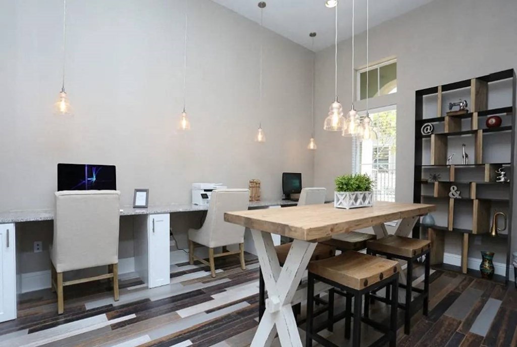a dining room with a wooden table and chairs at Kings Cove, Texas