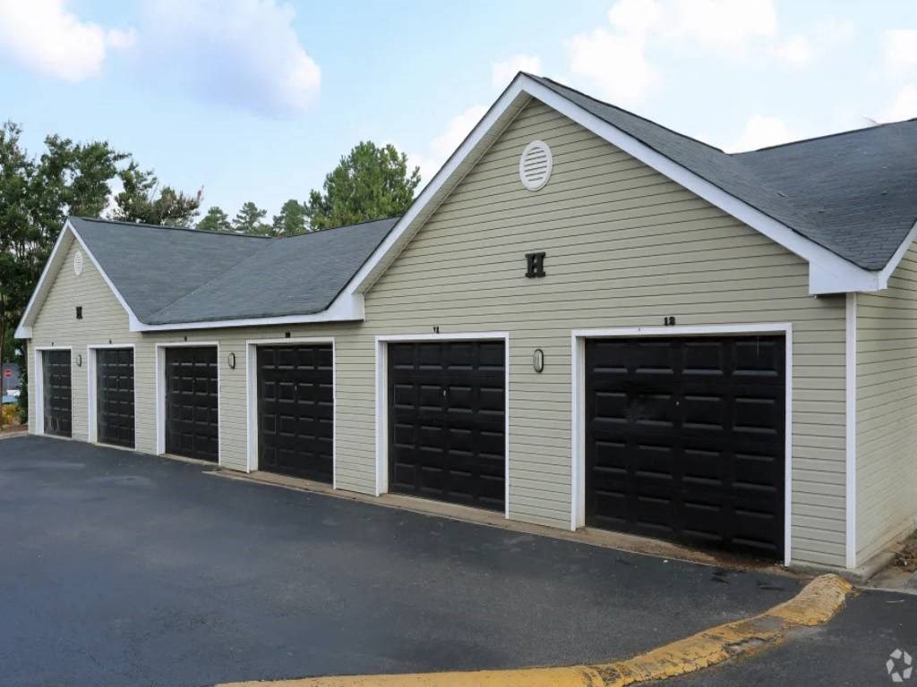 a row of garage doors on the side of a building