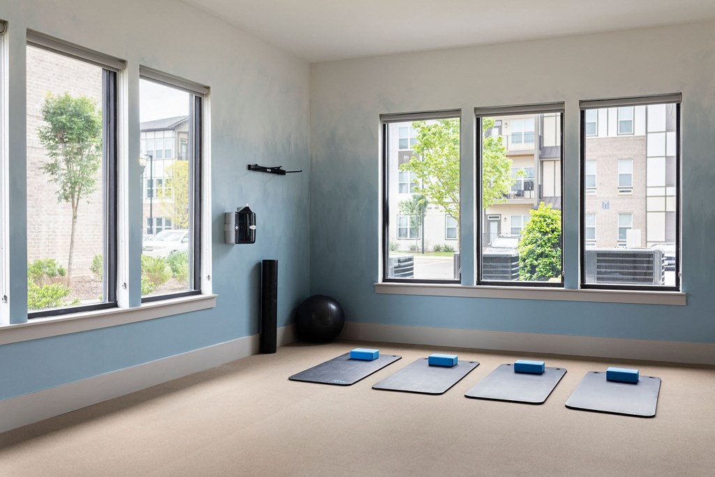 a group of yoga classes in a room with windows at The Cannon, Murfreesboro Tennessee