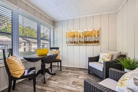 A sunny day outside the window and a yellow bowl on the table.