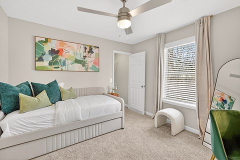 Open and airy bedroom with ceiling fan at Saddlebrook Apartments