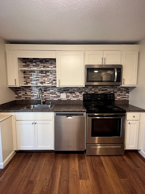 Kitchen with cabinets at Summit Terrace at Woodland Apartments, Cape Elizabeth, ME, 04107