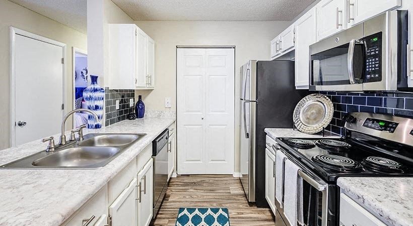 Amberwood at Lochmere, Cary NC, kitchen with white cabinets and stainless appliances
