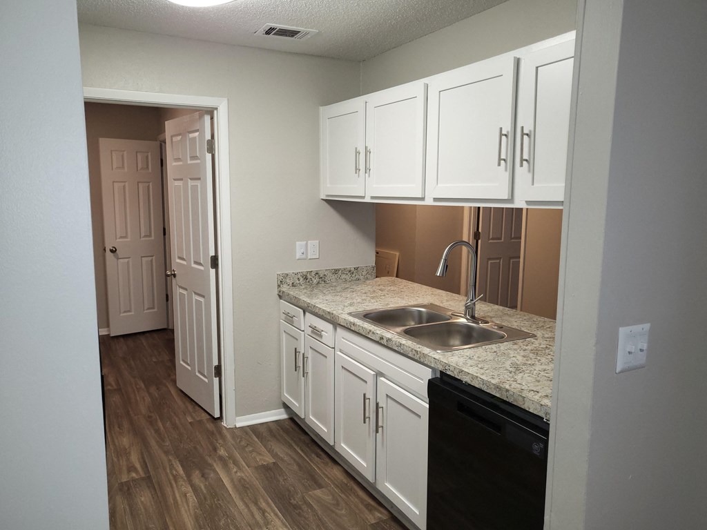 Renovated Kitchen with white cabinets at Magnolia Place at Stockbridge Apartments, Georgia