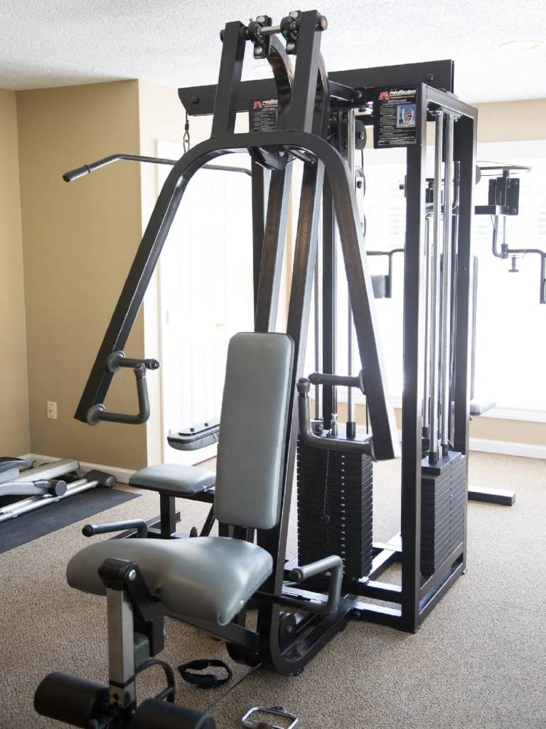 the gym has a lot of equipment in it