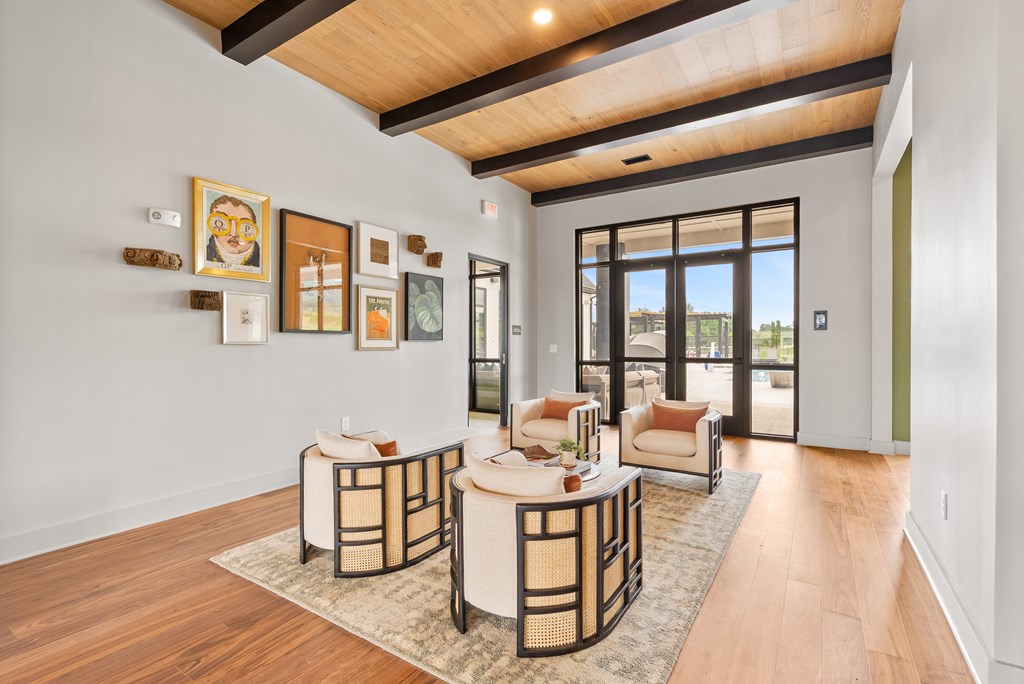 A living room with a white couch and a coffee table.