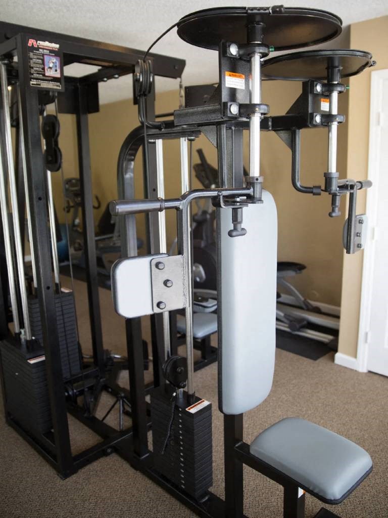the gym has a lot of equipment in it