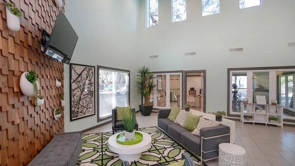 a living room with a couch and a table at Elevate at Huebner Grove, San Antonio, 78230