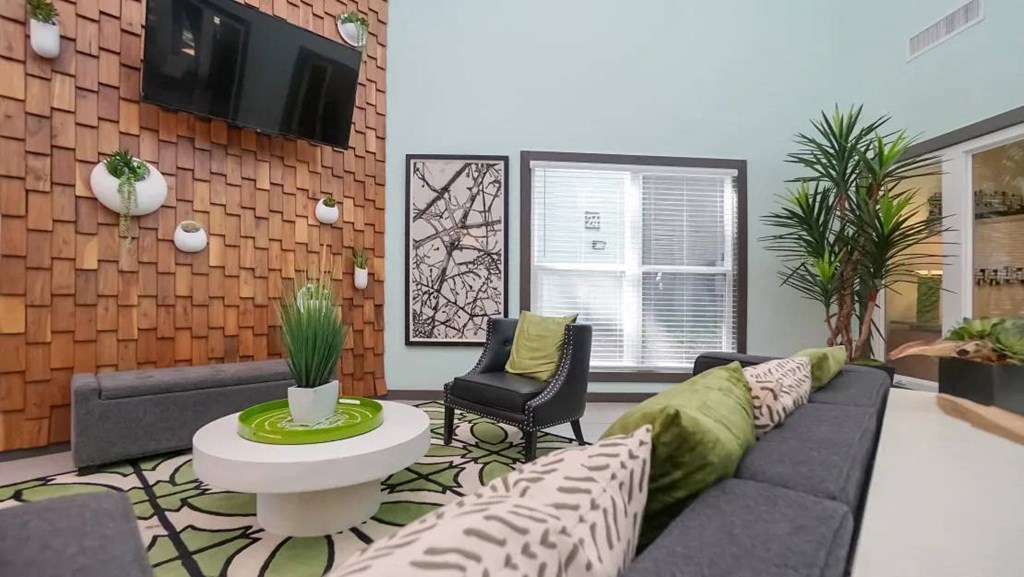 a living room with a couch and a table at Elevate at Huebner Grove, Texas, 78230