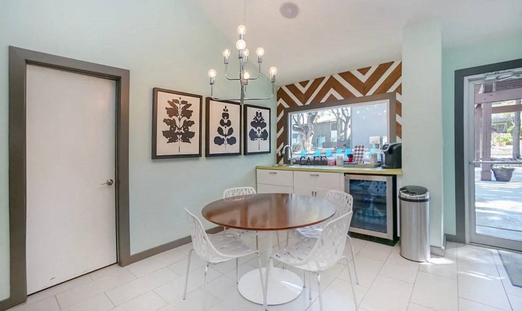 a dining room with a table and chairs at Elevate at Huebner Grove, Texas, 78230