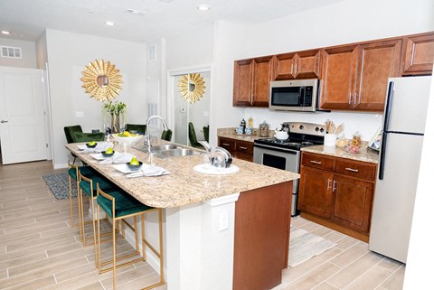 a kitchen with a marble counter top