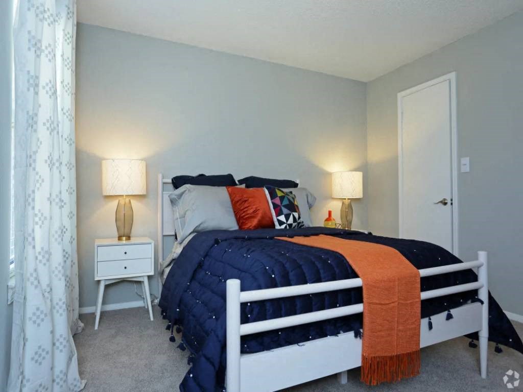 a bedroom with a bed and a closet