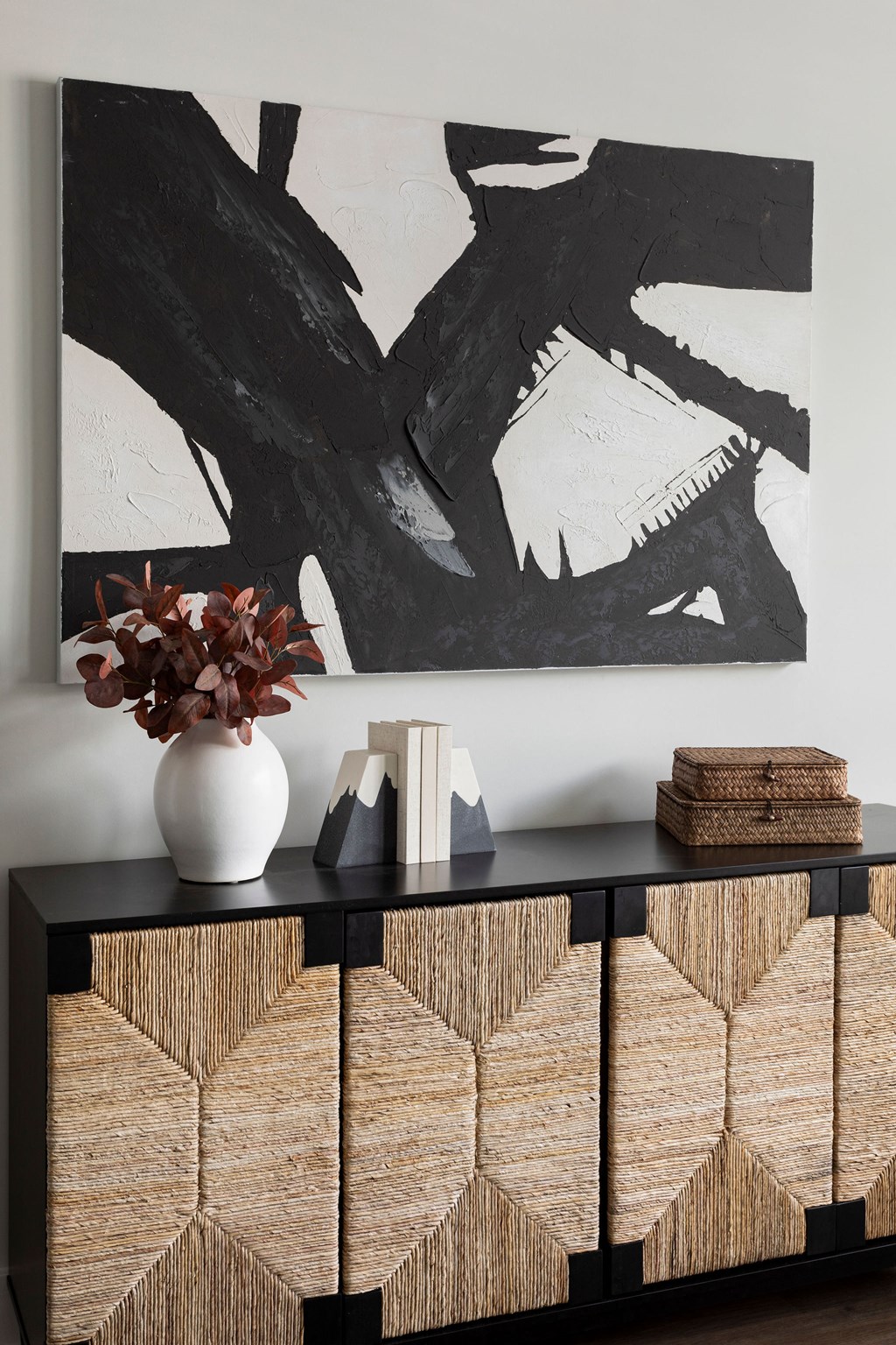 a cabinet with a vase and a painting on the wall at The Cannon, Tennessee, 37130