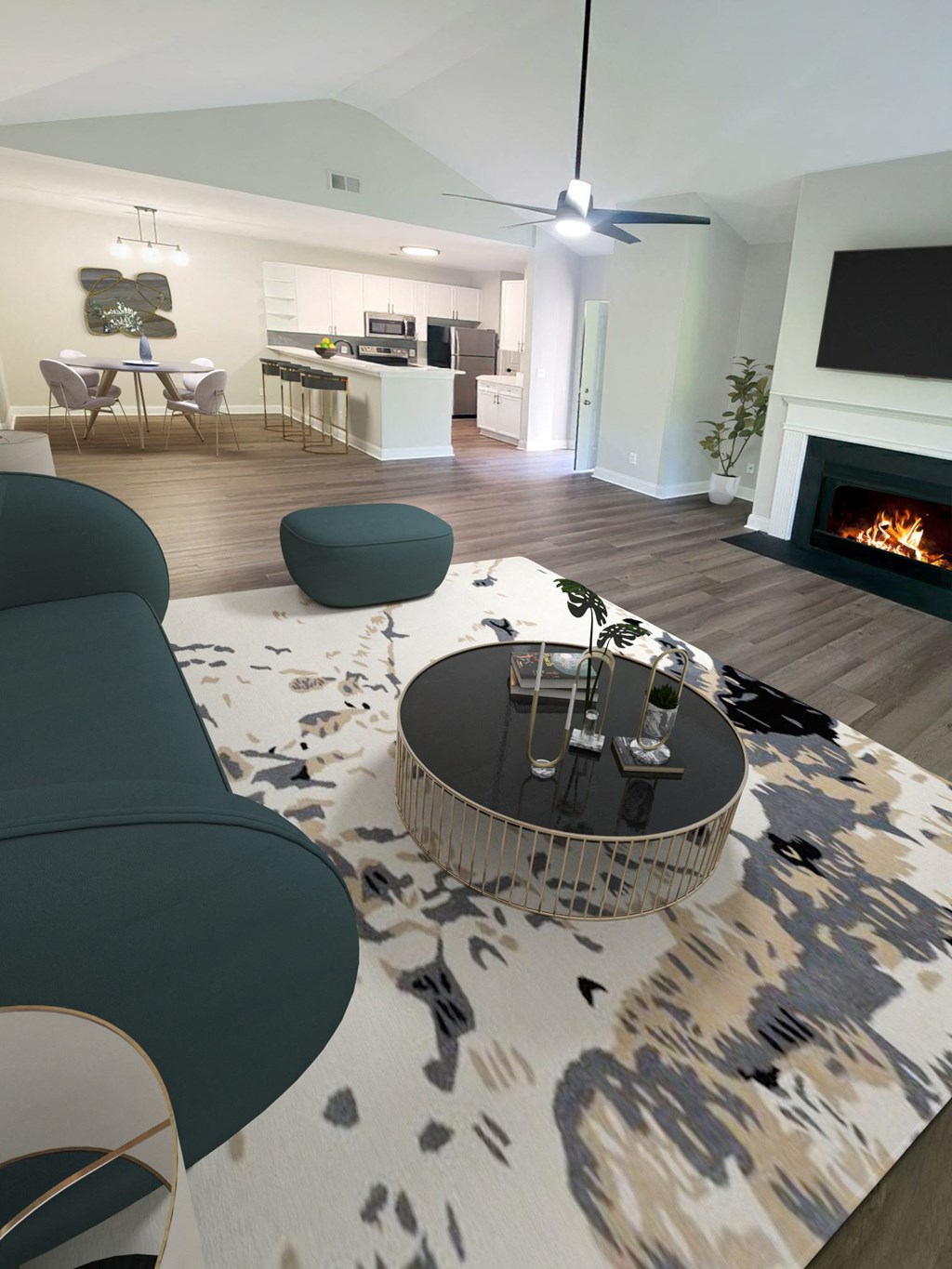 a living room with a couch and a table and a fireplace