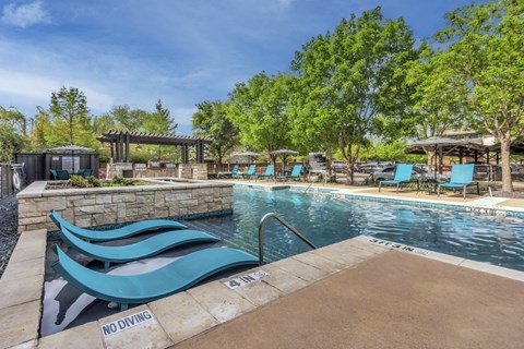 A pool with a "NO DIVING" sign on the edge.