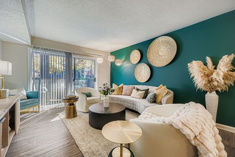 A living room with a white couch and a coffee table.