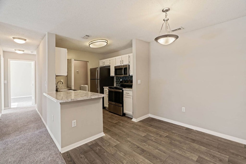 Amberwood at Lochmere, Cary NC, dining room with light fixture leading into kitchen
