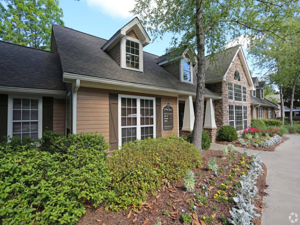 a house with a sidewalk in front of it