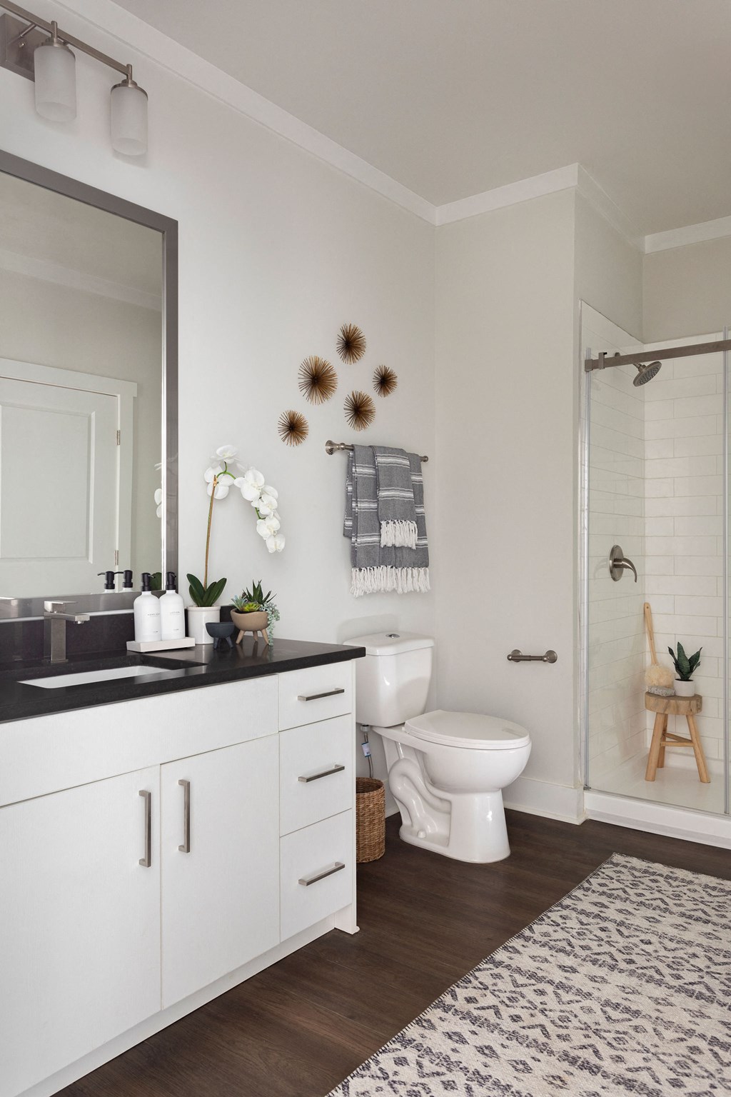 a white bathroom with a toilet and a shower at The Cannon, Murfreesboro