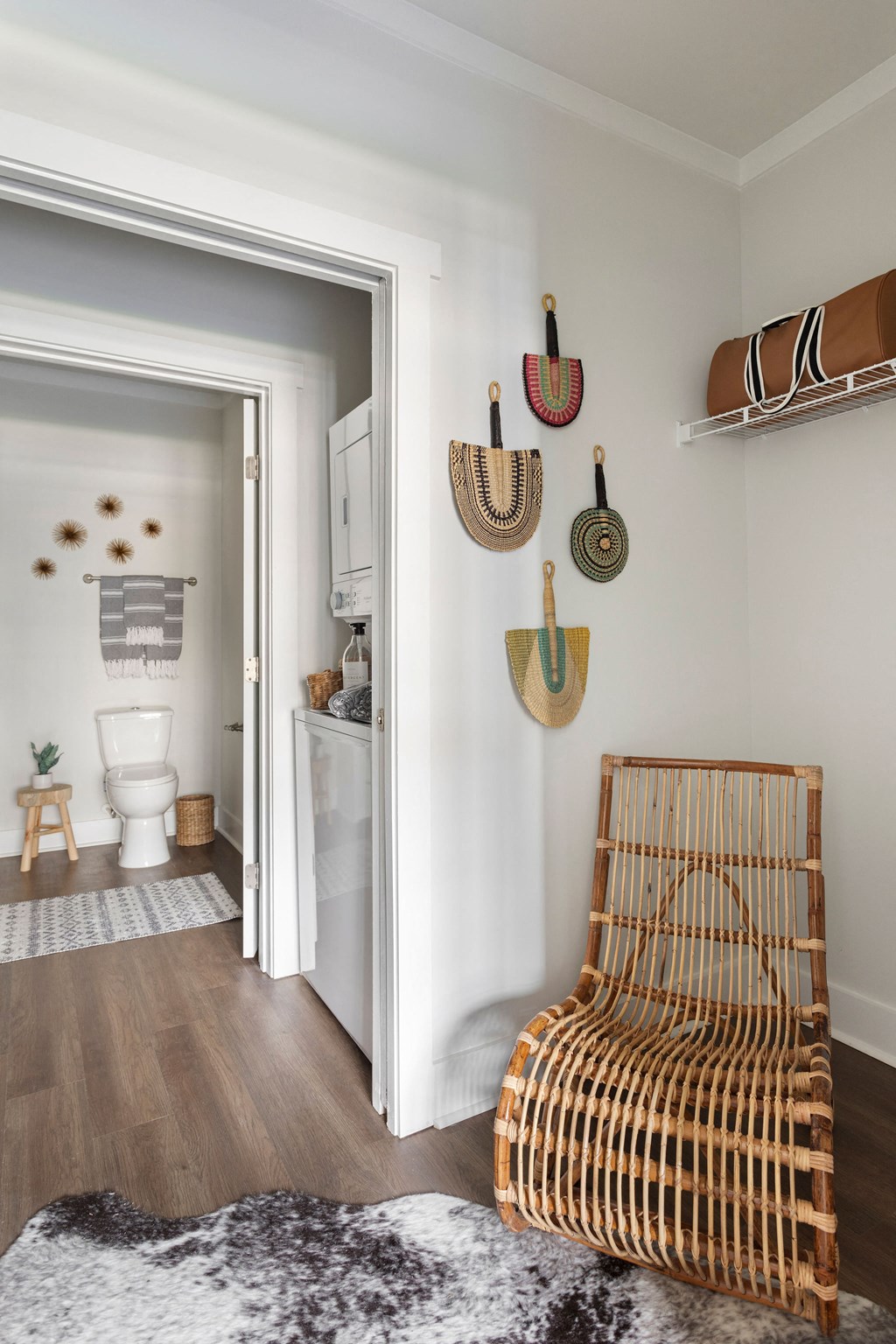 a living room with a chair and a bathroom with a toilet at The Cannon, Murfreesboro, TN 37130