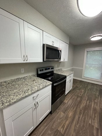 Kitchen area at Arbors at East Cobb Apartments, Georgia - Photo Gallery 36