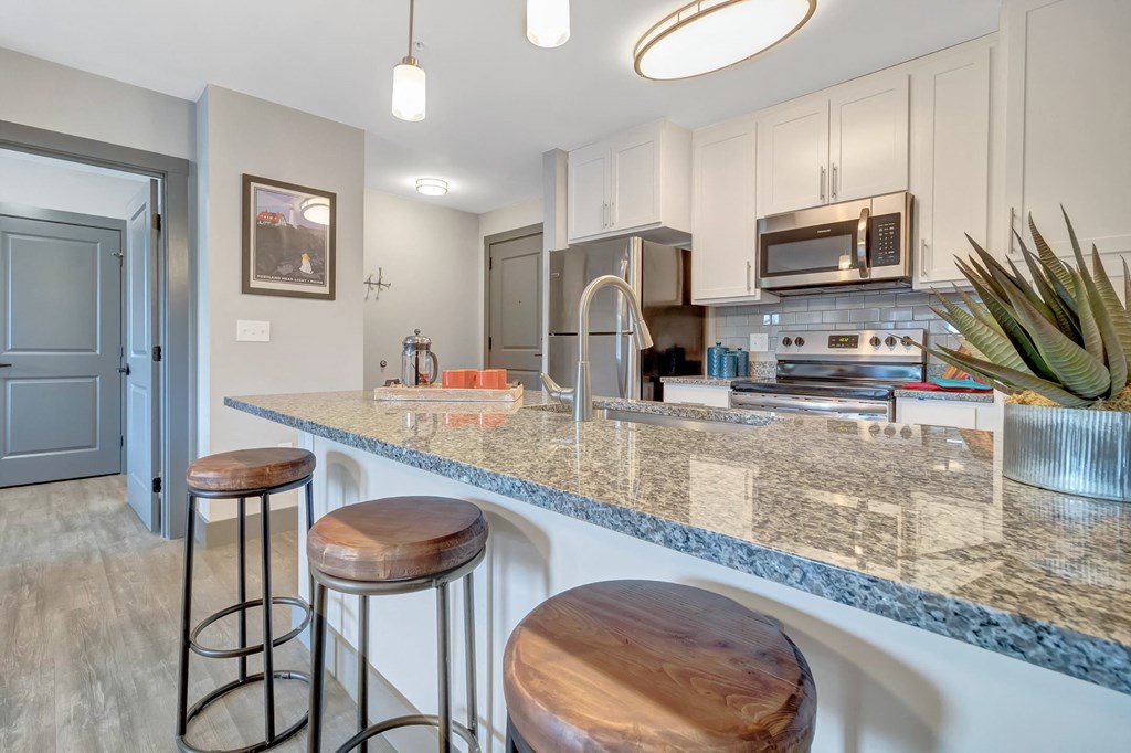 Kitchen with White Shaker Cabinetsat Latitude at South Portland Apartment, Maine, 04106