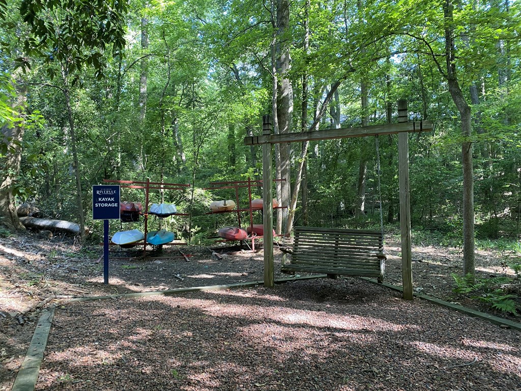 a swing set in the middle of a wooded area at Vinings RiverVue Apartments, Atlanta, GA, 30339