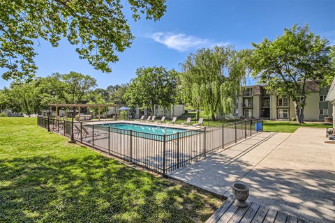 the preserve at ballantyne commons community pool with fence and trees