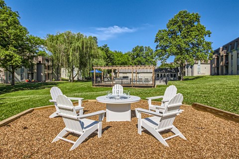 the preserve at ballantyne commons clubhouse with patio furniture and grass