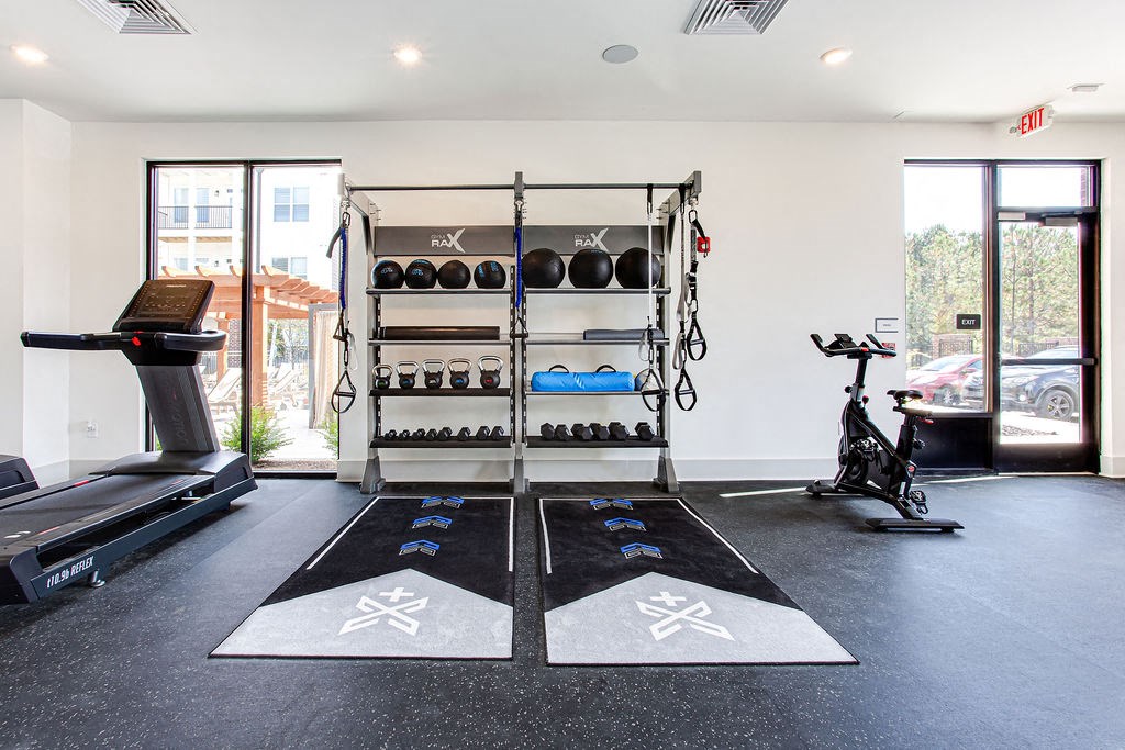 the gym at the flats at big tex apartments at The Indigo Apartments, Canton, 30114