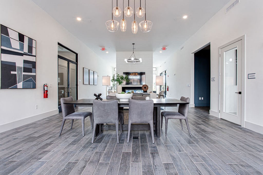 a dining room with a table and chairs at The Indigo Apartments, Canton
