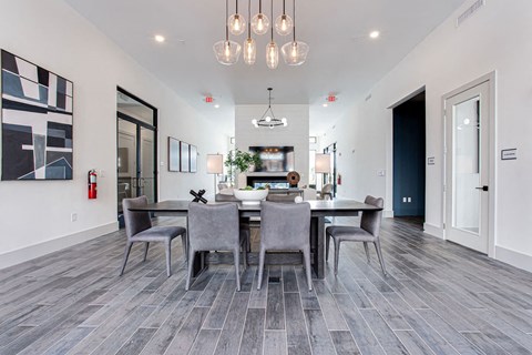 a dining room with a table and chairs at The Indigo Apartments, Canton