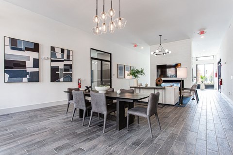 a dining room and living room with a table and chairs at The Indigo Apartments, Canton, GA, 30114